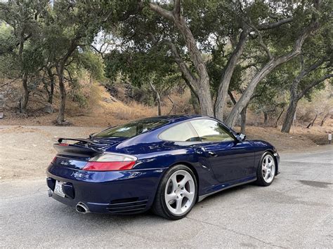 dark blue 2002 porsche 911.